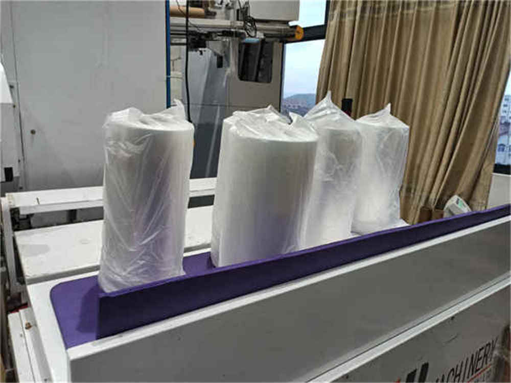 Machine d'emballage de palettes utilisant un film d'emballage